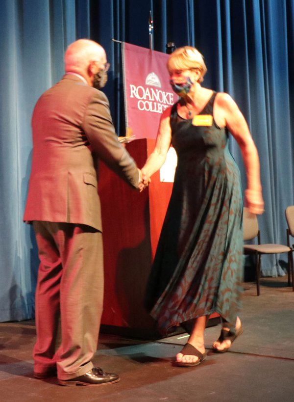 Roanoke president Mike Maxey congratulates SML Arts Council's Karen DeBoard.jpg