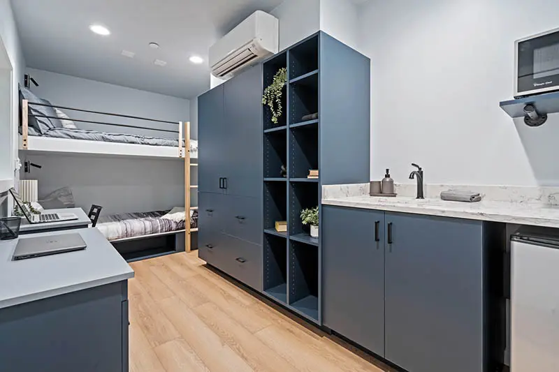 Inside, the shipping container rooms offer a modern style, with state-of-the-art HVAC systems.