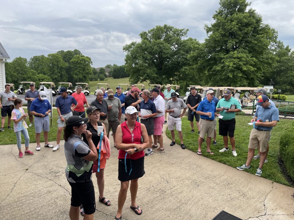 Participants in the 25th Annual Smith Mountain Lake Invitational await the results of raffle and door prize drawings following play on June 11 at Copper Cove Golf Club.