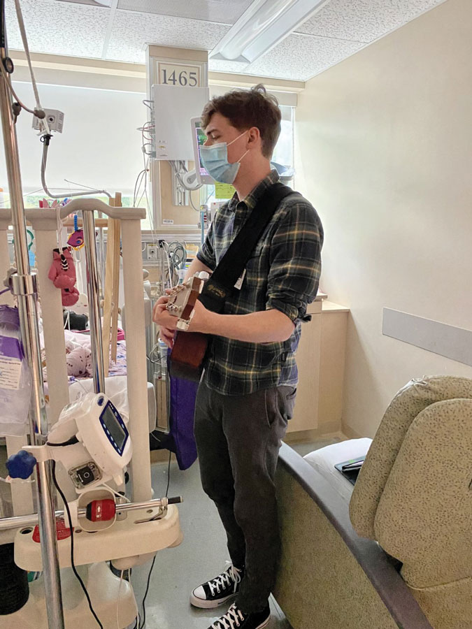 Guitarist John Pence plays and sings “My Girl” by request in Roanoke Memorial Hospital’s Neonatal Intensive Care Unit (NICU) recently.