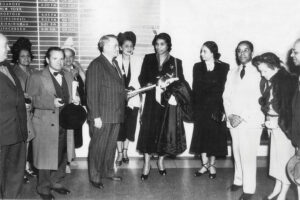 Mayor A. R. Minton (center) greets Marian Anderson (center, holding coat) along with Rev. William Simmons (right) and others from Fifth Avenue Presbyterian Church.
