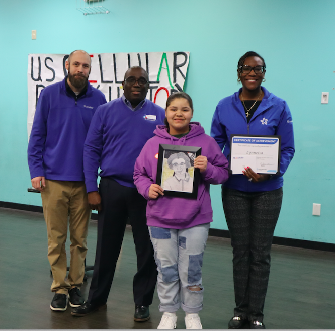 Pictured here: from left to right, from UScellular, Darren Chilson and Bertram Daniels; Third Place Winner of the 16th Annual Black History Month Art Contest Lynneisa Redd, 11, from Shawsville and Nakeita Stewart from UScellular.