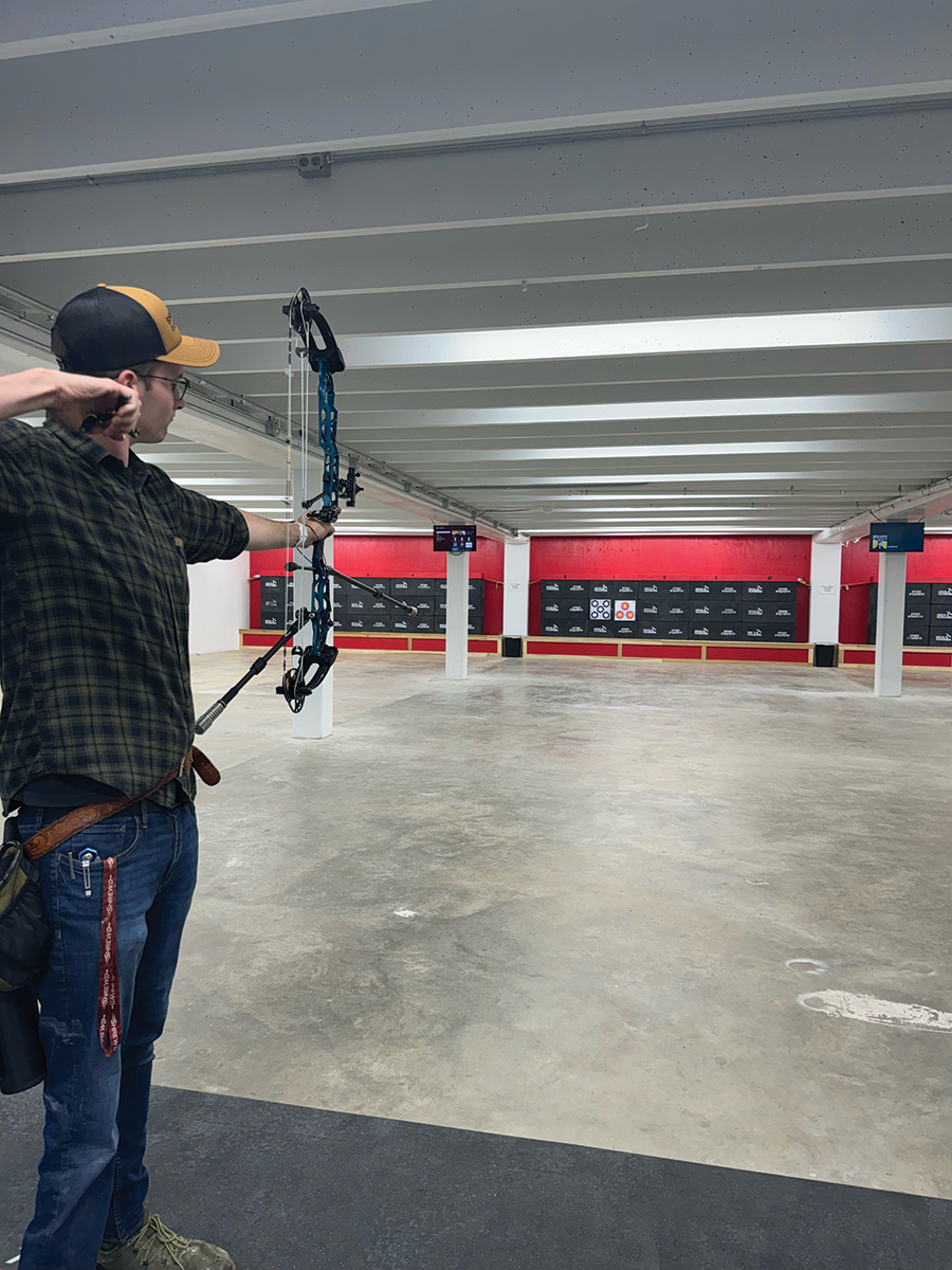 Archery manager Josh Pope takes aim.