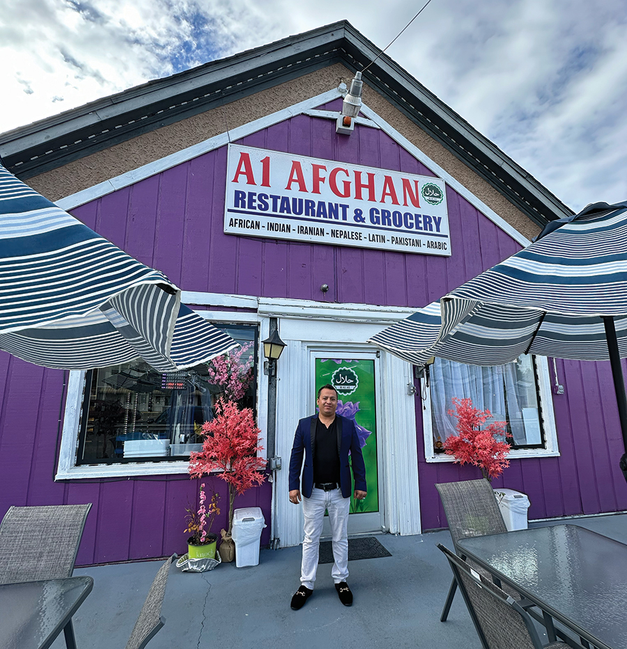 Owner Hussain Ghanizada outside his Williamson Road eatery and grocery store.