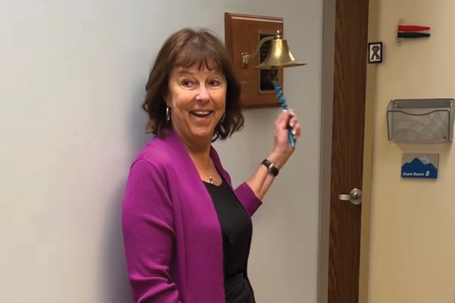 Becky Pollard ringing the bell at Blue Ridge Cancer Care after her last cancer treatment.