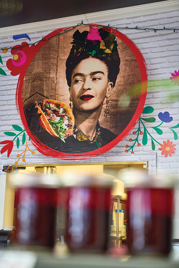 The first thing you’ll notice when you step into Birrieria La Vaca is the large portrait of Frida Kahlo.