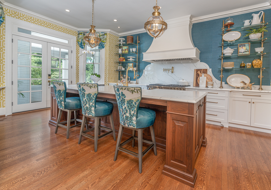 The custom barstools have a decorative fabric on the back, and turquoise leather on the seat for durability.