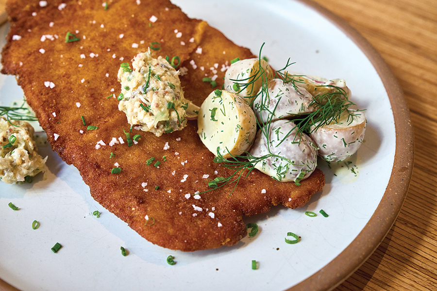 The Fried Pork Schnitzel dish is one of many to enjoy in their bright, airy space.