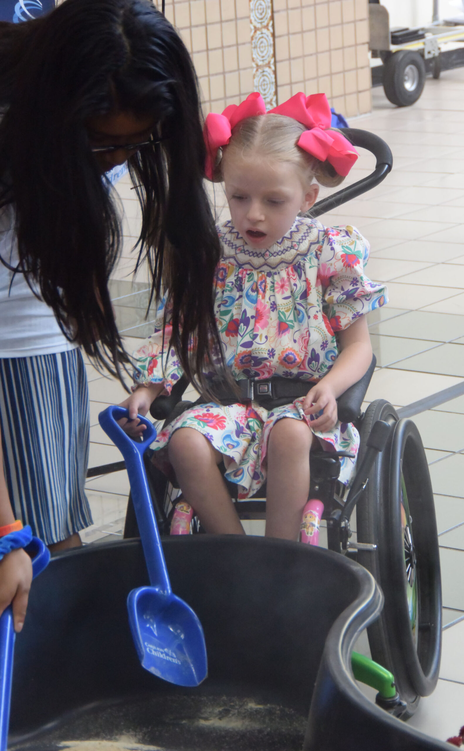 Carilion patient Meg Barrow, 6, helps break ground.