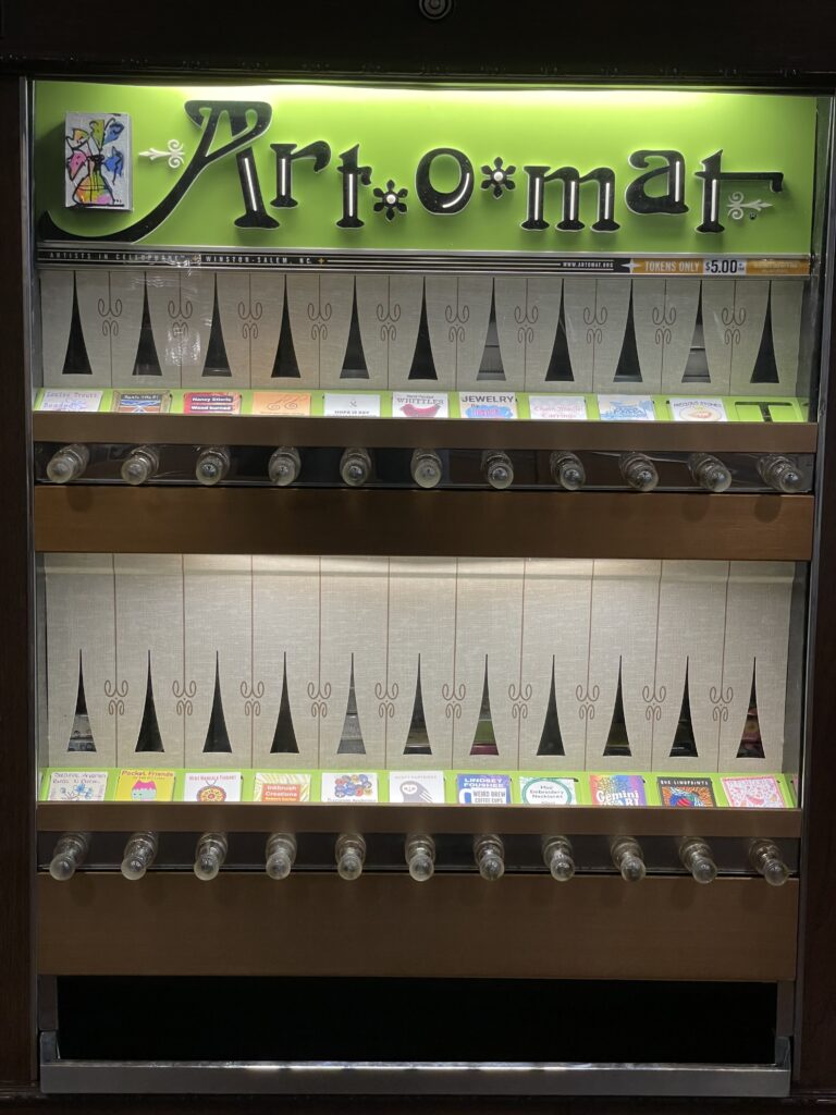 Bread Craft’s Art-O-Mat machine has twenty two slots, one for each artist represented.