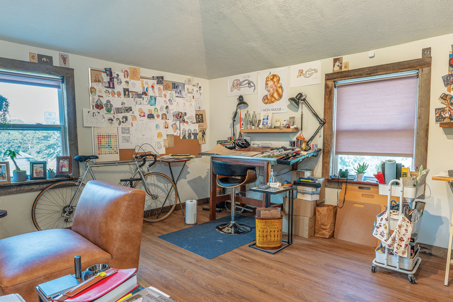 An outdoor garage with loft was converted into this playful studio space, perfect for the family artist!