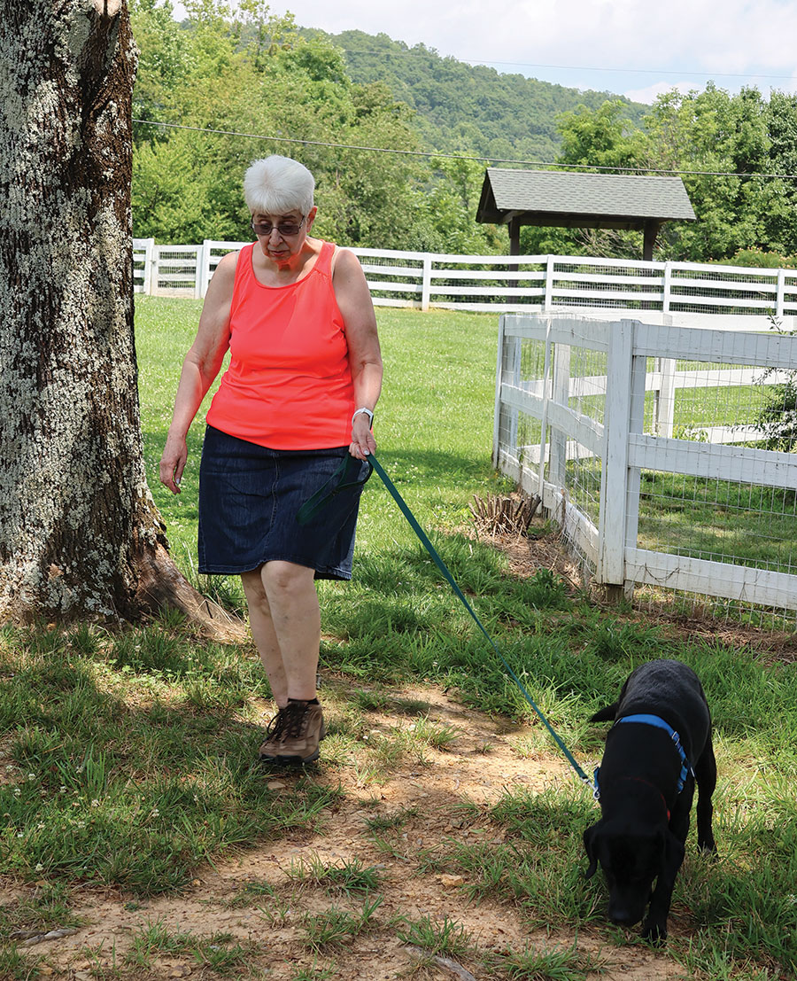 Jean Evans is one of many retirees who volunteer as dog walkers at Saint Francis Service Dogs.