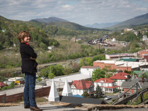 Joan Vannorsdall stands on Pine Street overlooking the Town of Clifton Forge and the railyards that wind their way through the Alleghany Highlands.