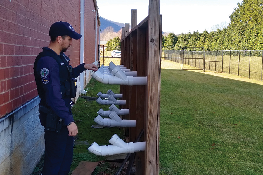 Officer Winstead demonstrates the scent wall.