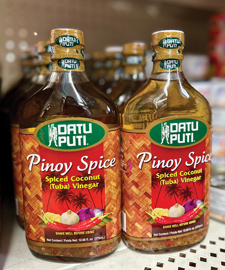 Filipino pantry staples like vinegars, sauces and seasonings line the shelves.