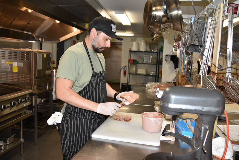 Head Chef Matt Lintz whipping up an entrée at Crystal Spring Grocery.