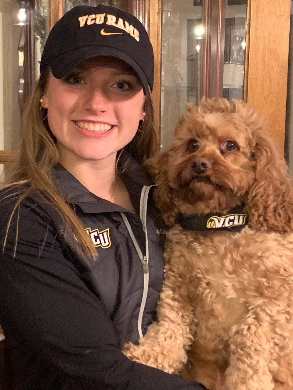 Higgins and her dog, Sammy, proudly sport VCU emblems after Higgins was named one of 10 signees to join the university’s women's soccer program this fall.