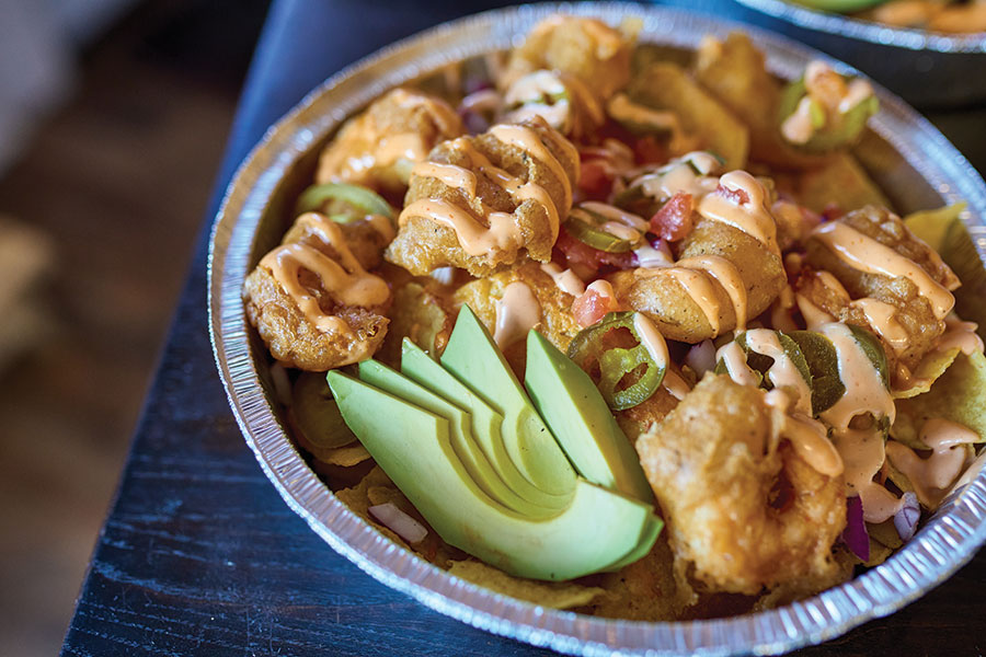 The menu's sleeper hit is the shrimp nachos, starring airy-crisp tempura-battered shrimp.