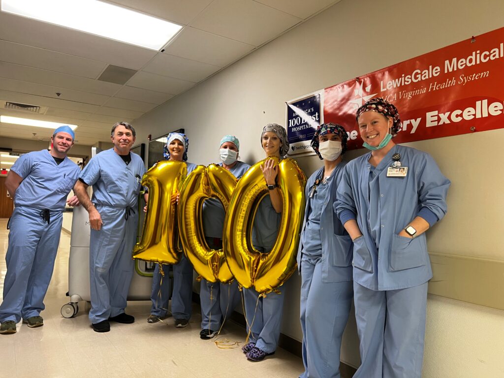 LewisGale Medical Center robotic surgery team celebrates successfully completing its 100th robotic-assisted spine surgery.