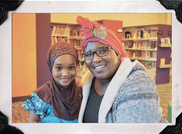 Four-year-old Amida Ramadhan and her mother Evelyne Nzikobanyanka visit Raleigh Court Branch Library on a recent afternoon. ©Christina Nifong