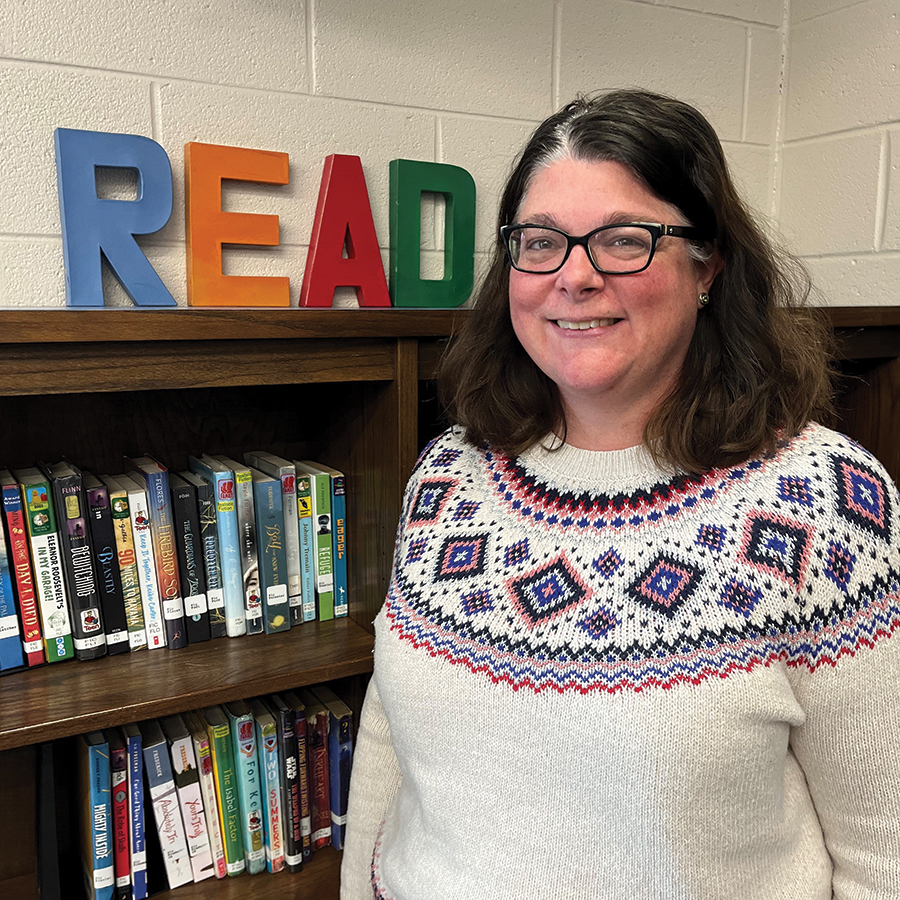 Woodrow Wilson Middle School librarian Kate McDaniel enjoys sharing her favorite Young Adult authors with young people.