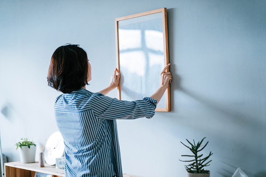 Rearranging a room can be as simple as new wall hangings (or finally hanging it after it’s been stored away for a while).