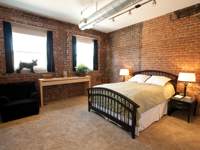 Scofield, the couple’s Schnauzer, likes the view to Salem Avenue from a master bedroom window.