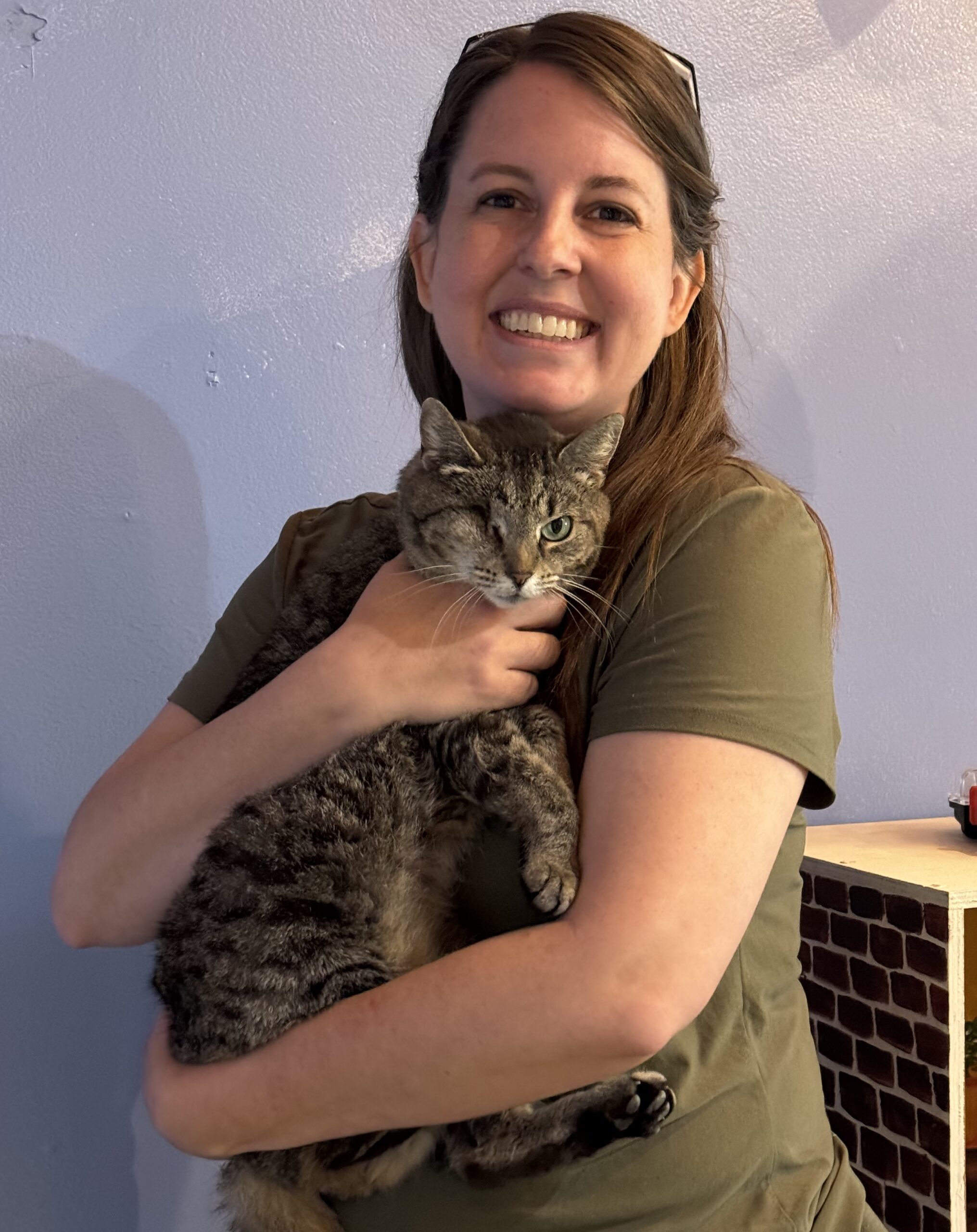 LS Ackerman and One-Eyed Willie, the shop cat and only permanent feline resident at Blue Ridge Indie Market.