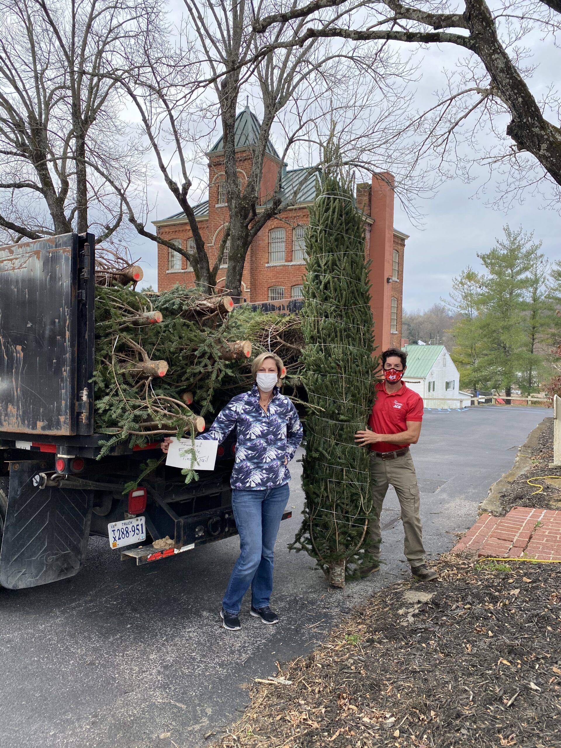 Rockingham Cooperative delivered the trees for the trail to Lisa Otey, left, on Nov. 25.