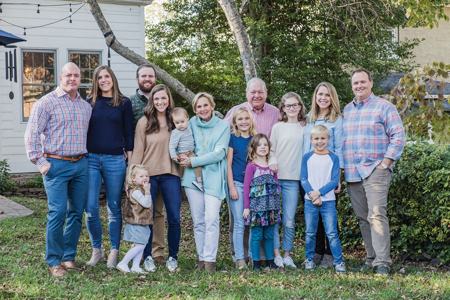 The Kiser family smiles for a group holiday photo.