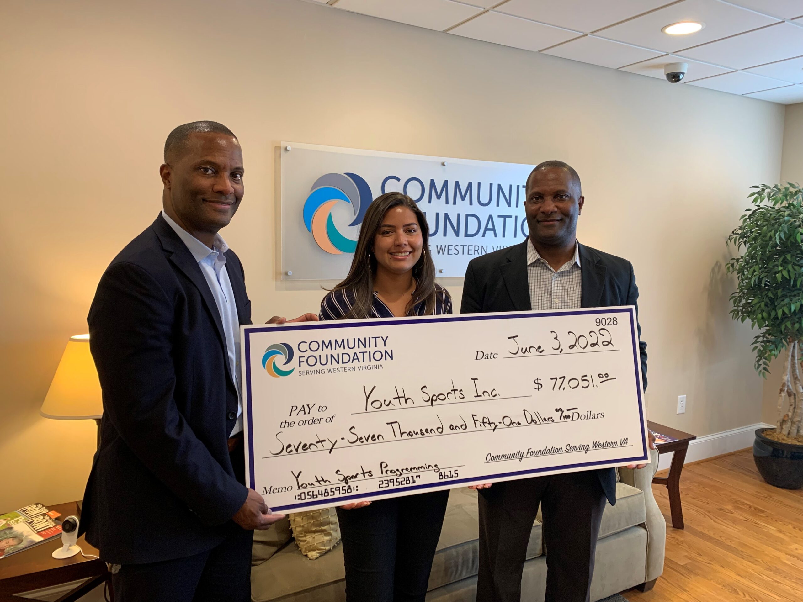 Pictured L-R: Damon Williams, President of Youth Sporting Incorporated, Ana Maria Barrios, Finance Associate of Community Foundation Serving Western Virginia, and Ramon Williams, Vice President of Youth Sports Incorporated.