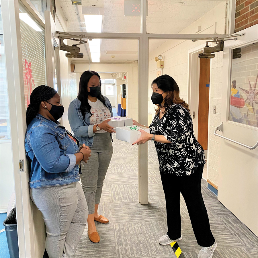 Mrs. White thanks her employees with a goody box and hand-written note.