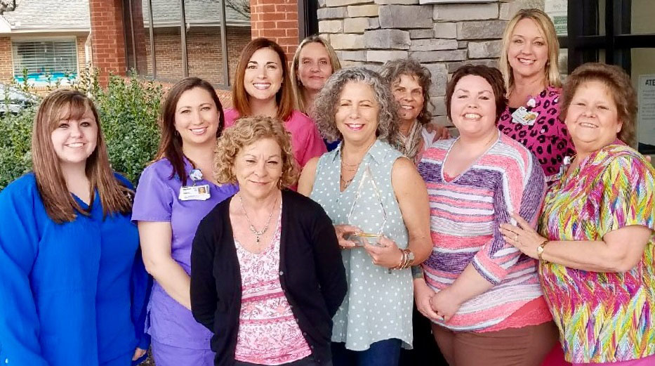 LG Imaging staff shows off its prestigious award.