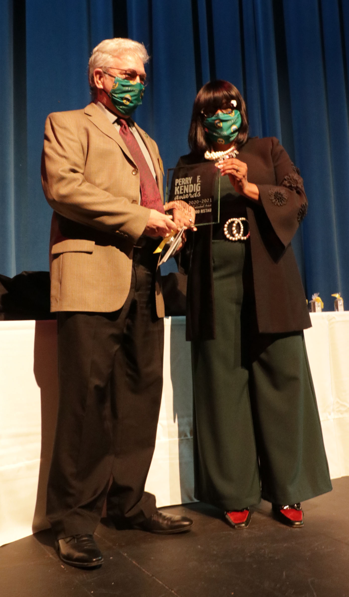 Todd Ristau accepts his award from Roanoke President Dana Hinton.