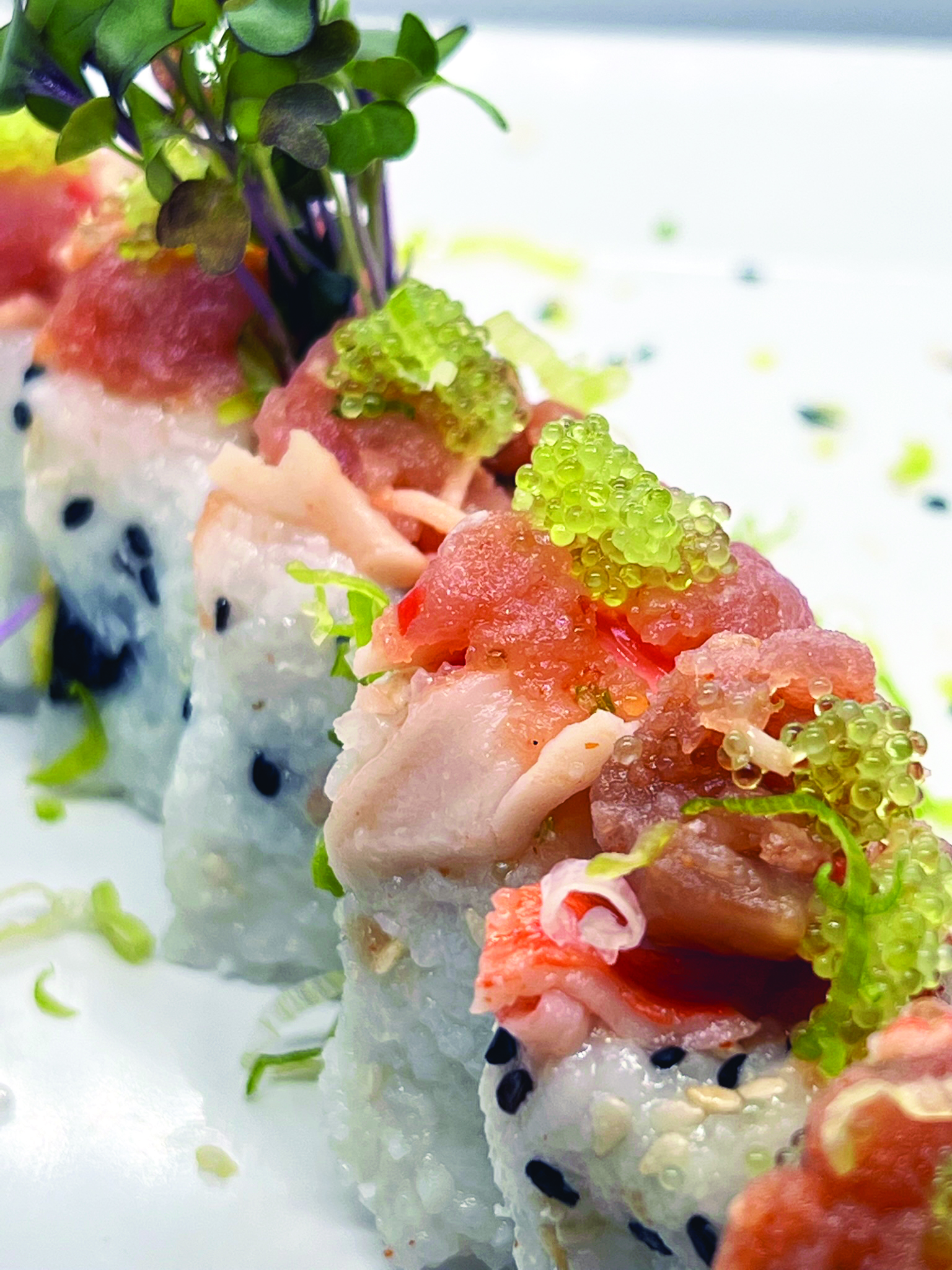 The Dynamite Roll special featured spicy mixed fish atop a pickled Jalapeno and cream cheese roll.