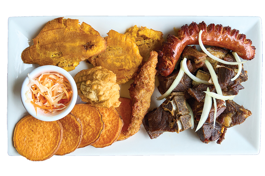 Fried Entrees, like the crisp-tender-chewy goat, come with a medley of tasty accompaniments.