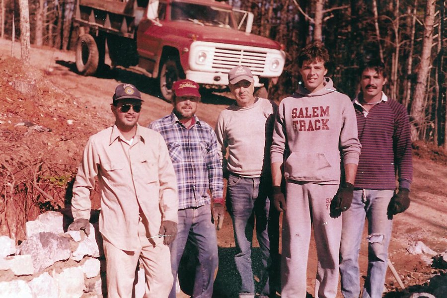 Kelly Francisco, his dad, and brothers at a work site.
