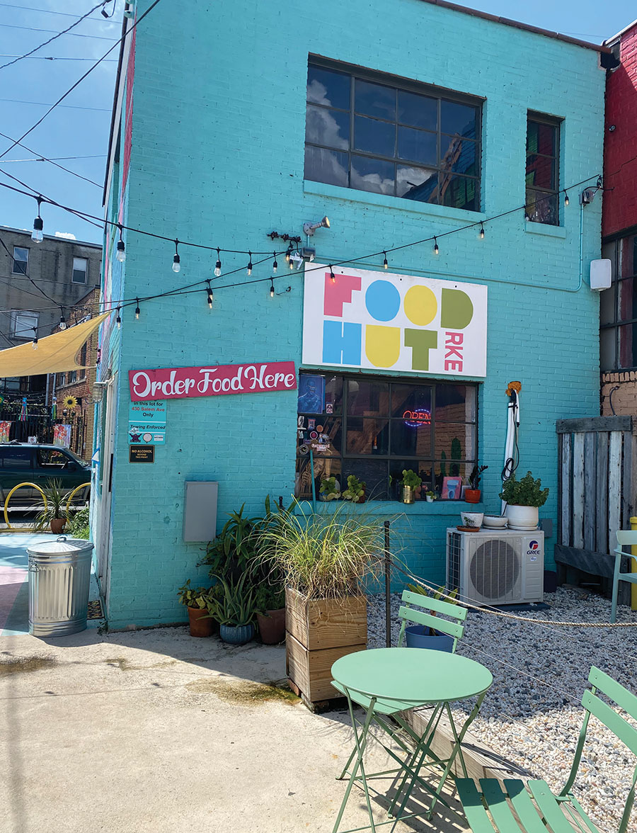 Food Hut serves a menu of elevated comfort food from a cheery walk-up window next to Golden Cactus Brewing. © Layla Khoury-Hanold

