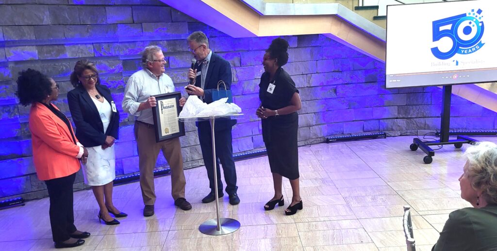 Roanoke Vice Mayor Joe Cobb presents Fetzer with a Proclamation of October as Bob Fetzer Month.