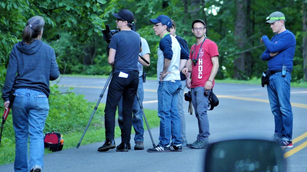 Writer/director Dean Kapsalis (center, in blue and white shirt) and producer Tommy Minnix (far right) brought the Epic Pictures project to Roanoke in 2017. Art director Jenna Giannini (far left) and the film crew were local hires.