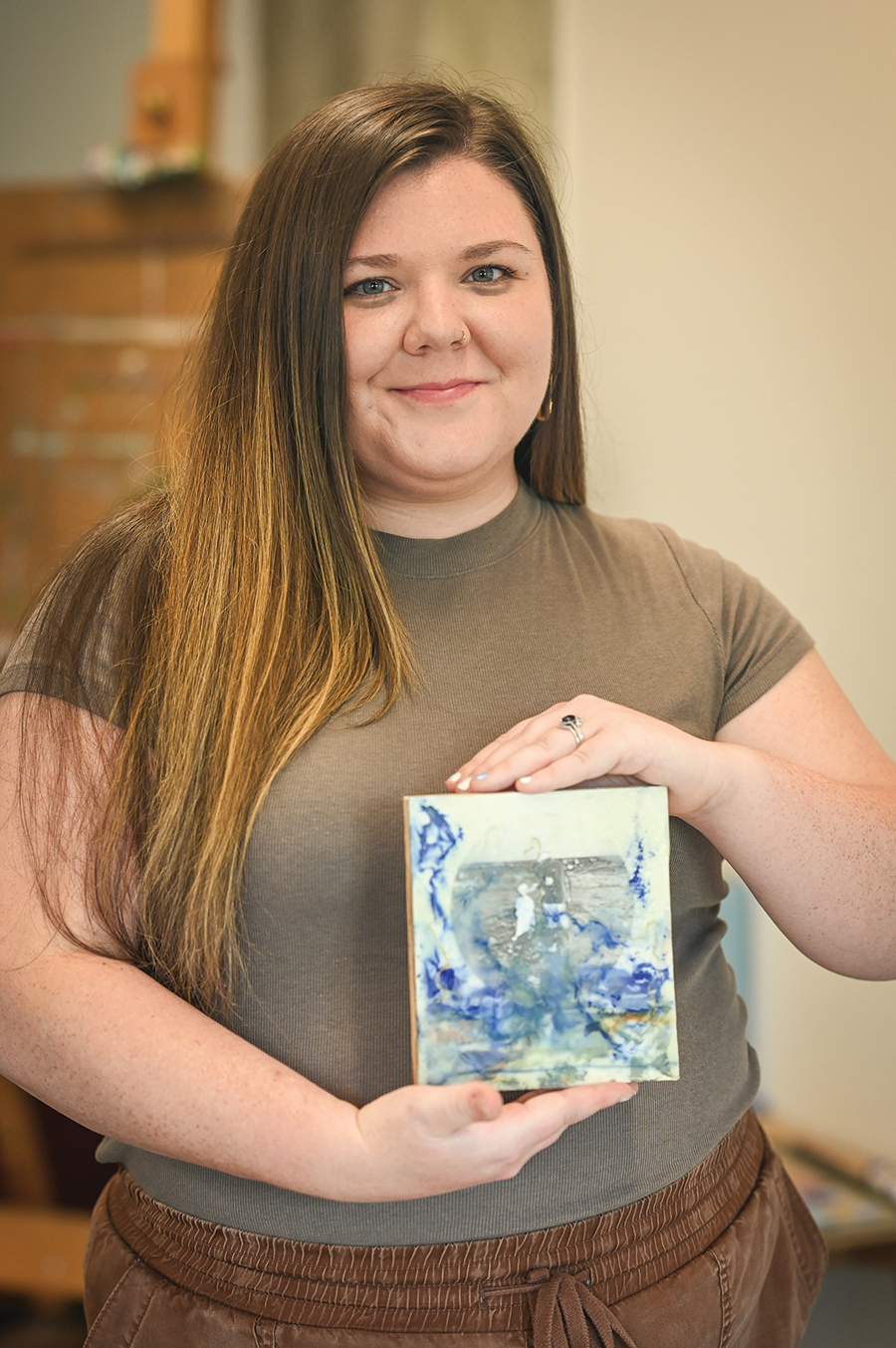 Hollins graduate Ashley King has spent the last two years experimenting with applying harsh chemical baths to family photographs, then encasing the results in encaustic wax. “Taking personal experiences and putting them in your artwork is hard, because you set these expectations for it,” King admits. “You have to remove yourself a little bit.”