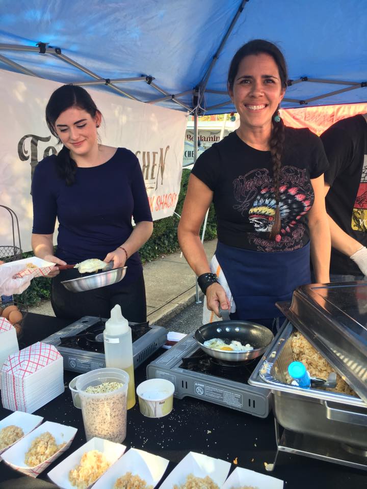 Melanie Srsic, owner of Town Kitchen & Provisions, serving at Bedford's Finest Fare.
