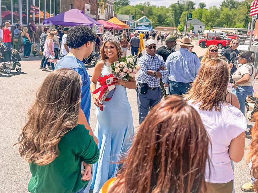 Friends and family gathered around to congratulate 2025 Miss Dogwood Festival Queen Jada Johnson.