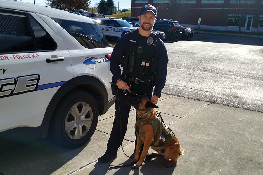 Officer Nathaniel Winstead and Mavric prepare to head out on patrol.