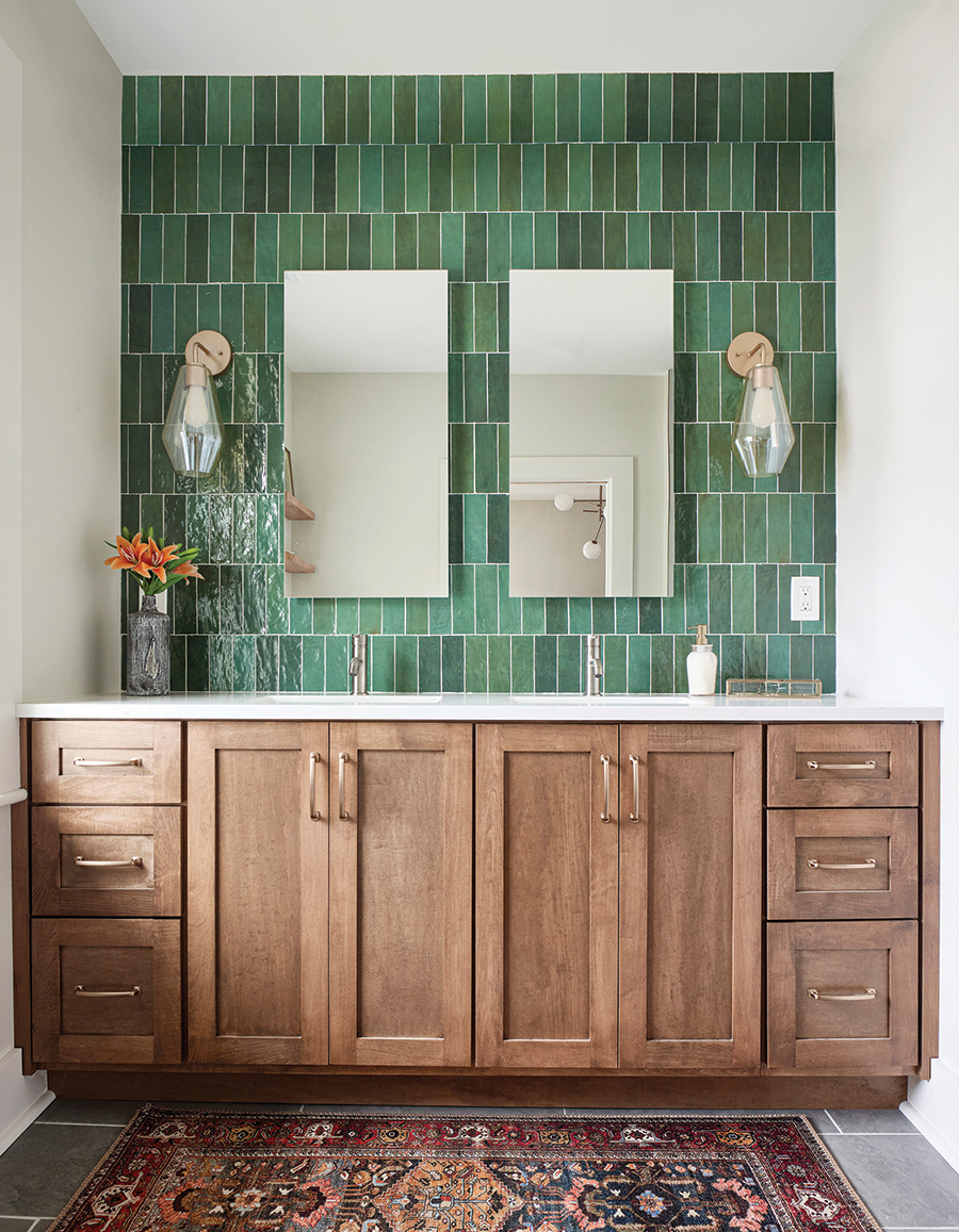 Amanda wanted green for the backsplash behind the sinks and Teresa found it. Amanda says, “The green tile gives it warmth and elegance rather than just being a regular bathroom.”