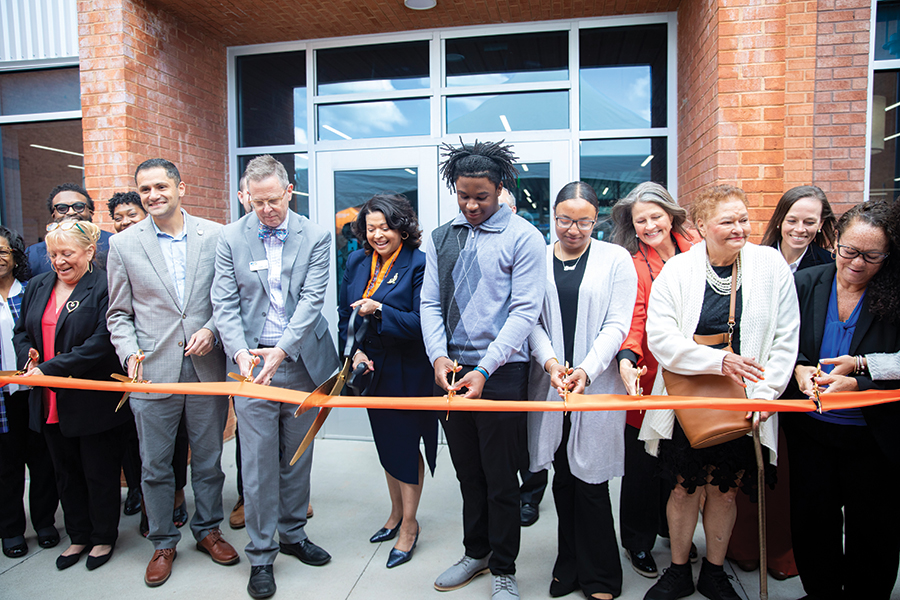RCPS celebrates a new building with a ribbon cutting.