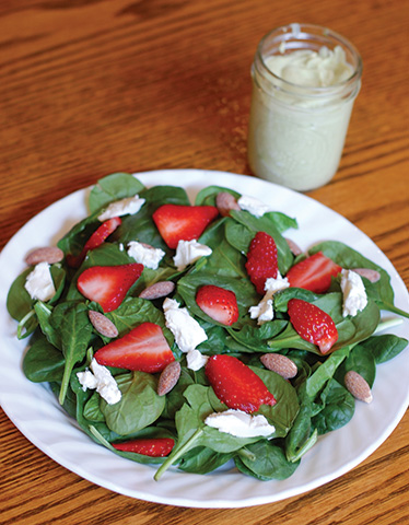 Strawberry and Goat Cheese Salad with Toasted Almonds and Creamy Avocado Dressing