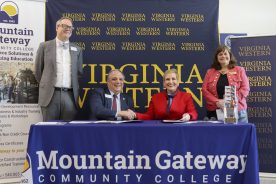 Mountain Gateway Community College and Virginia Western Community College signed an agreement on Tuesday, Feb. 24, to enhance Commercial Driver’s License instruction and regional workforce readiness. Pictured are (from left): Dr. Ben Worth, Vice President for Academic Affairs with Mountain Gateway (standing); Dr. John Rainone, President of Mountain Gateway (seated); Dr. Laura J. Treanor, President of Virginia Western (seated); and Dr. Elizabeth Wilmer, Vice President of Academic and Workforce Solutions with Virginia Western.