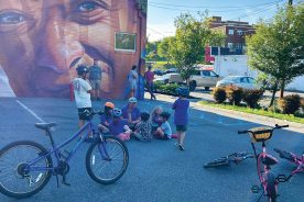 WeeWheel Roanoke began offering Learn to Ride classes last fall. Here, kids circle up at the end of a recent class in the parking lot behind Cardinal Bicycle in Grandin Village.