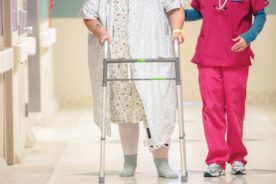 Carilion nurse Molly Clemons assists Barbara Adams, who is recovering from a knee replacement.